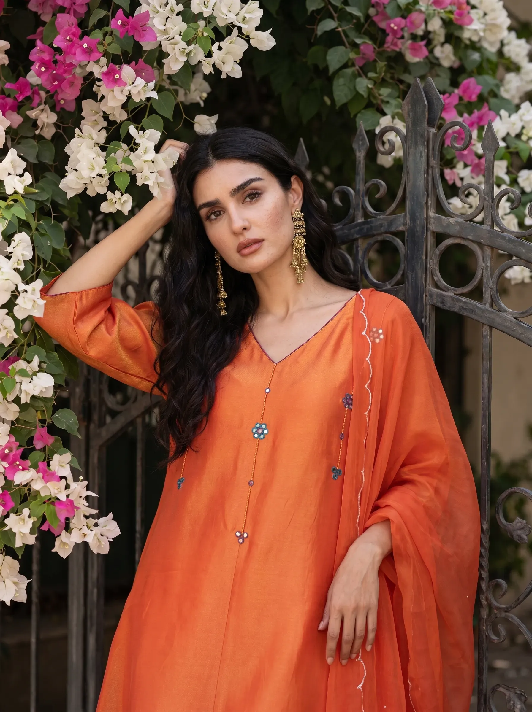 Artisan hand-block printing and embroidering a kurta set